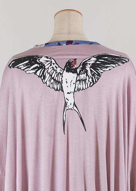 GOUK swallow printed behind a relaxed eye light purple